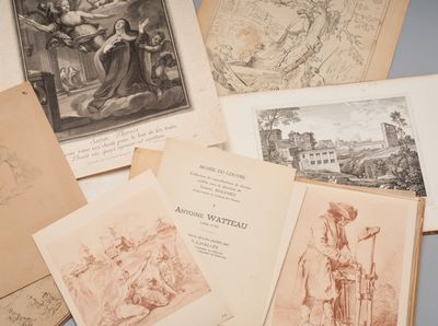 many old books on the table with drawings on them