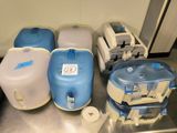 many different types of water containers on the table