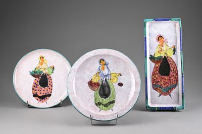 three plates with different designs on them sitting on a table