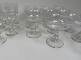 six wine glasses sitting on a table with a white background