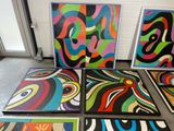 several pieces of art that are sitting on the floor