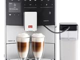 an image of a coffee machine with two cups of coffee in front of it