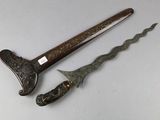 pair of antique chinese swords with carved handles and wooden handles