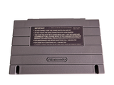 a nintendo game console sitting on top of a white surface