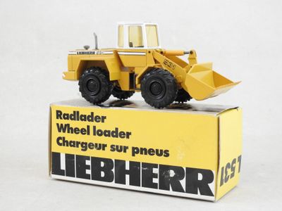 a toy truck that is sitting on top of a box