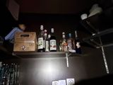 many bottles of alcohol on the shelves in the room