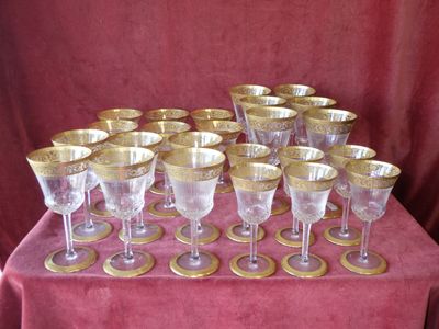 a lot of wine glasses sitting on a table