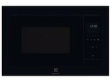 Le micro-ondes est noir et dispose d'une minuterie sur la face avant.