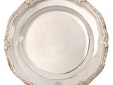 an image of a silver plate with rope around it on a white background