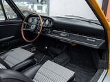a dashboard and steering wheel of a car in a car showroom