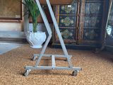 an image of a small table on wheels in the middle of a room