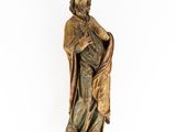 an image of a statue of a man holding a bag
