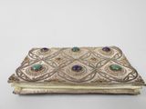 an old silver and gold purse with gems on it