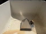 a small bird that is sitting in a white box