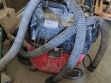 a vacuum that is sitting on the floor in a room