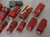a lot of toy fire trucks that are on the table