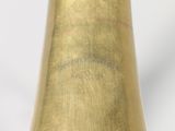 a close up of a brass bell on a white background