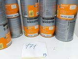 several tins of tins of paint sitting on top of a white table