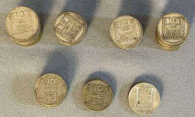 six different types of coins sitting on top of a table