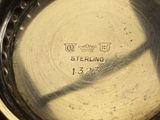 a close up of a silver plate with writing on it