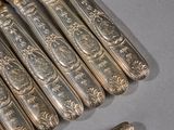 five silverwares and a knife on a table