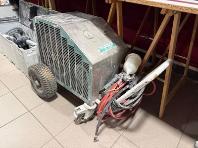 a machine that is sitting on the floor next to a chair