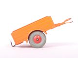 an orange toy truck with wheels on a white surface