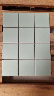 a picture of a square mirror on a wooden table