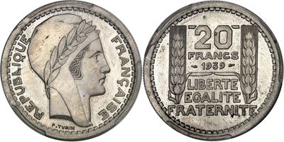 a silver coin with a woman ' s head on it