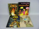 three children ' s books are lined up on a white surface
