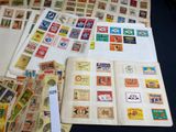 many different types of stamps on the pages of a book