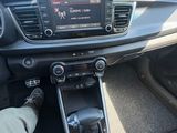 the interior of a car with a steering control and dashboard controls