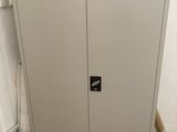 an image of a metal cabinet in the corner of a room