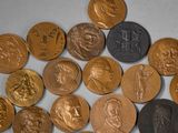 a lot of coins that are sitting on a table