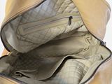 a person holding a purse with a zipper open