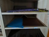 a shelf that has a bunch of books on it