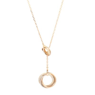 a gold plated necklace with a circle pendant and a chain