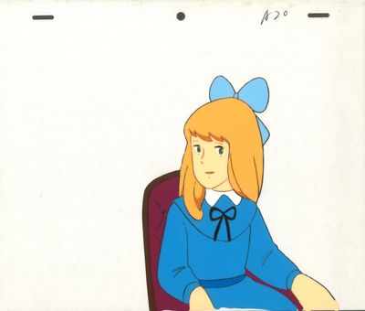 cellule d'animation représentant une fillette assise à un bureau avec un livre