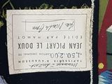 a label on the back of a tie with a picture of a man