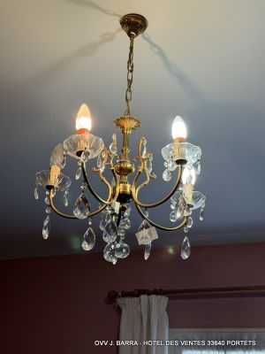 a chandelier hanging from the ceiling in a room