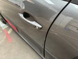 a car door handle with a hole in it