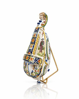 a figurine of a man carrying a bag on a stand