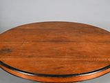 an image of a round table with a wooden top and metal legs