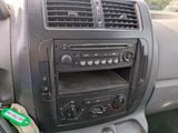 a car dashboard with a radio and other electronics in it