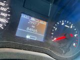 a close up of a speedometer on a car ' s dashboard
