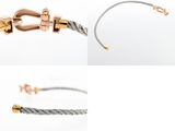 a close up of a pair of bracelets on a white background