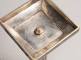 a small metal object that is sitting on a table