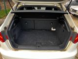 a trunk of a white car with its trunk open