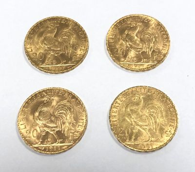 four gold sovereigns, one of which is a lion and the other of which is a lion