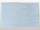 a book with a handwritten note inside of it